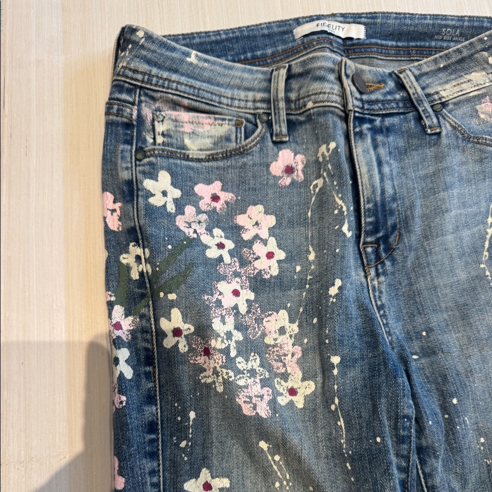 Light skinny jeans with painted floral design